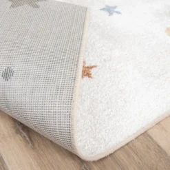 Waschbarer Kinderteppich - Ravi Stars Bunt